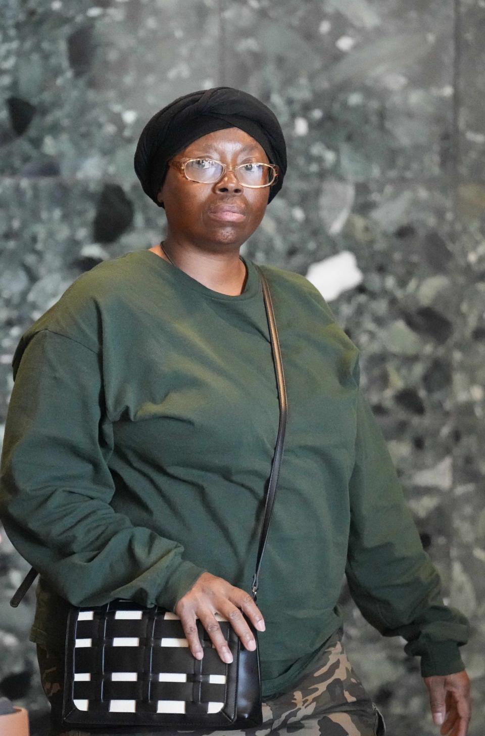 Sheneen McClain walks to the courtroom in the Adams County Justice Center for the start of the trial of two police officers charged in the 2019 death of Elijah McClain, Wednesday, Sept. 20, 2023, in Brighton Colo. (AP Photo/Jack Dempsey)