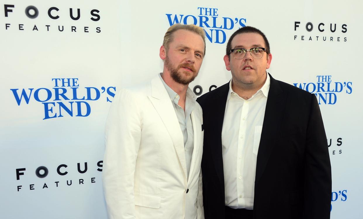 Actors Simon Pegg and Nick Frost pose on arrival for the L.A. Premiere of the film 'The World's End' in    Hollywood, California, on August 21 2013. AFP PHOTO/Frederic J. BROWN        (Photo credit should read FREDERIC J. BROWN/AFP/Getty Images)