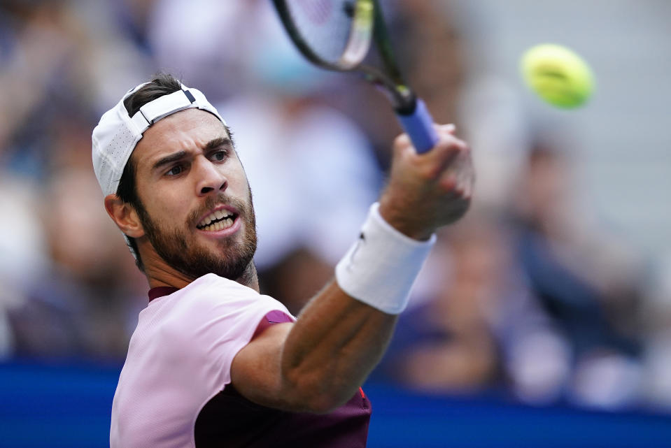 Karen Khachanov, of Russia, returns a shot to Casper Ruud, of Norway, during the semifinals of the U.S. Open tennis championships, Friday, Sept. 9, 2022, in New York. (AP Photo/Matt Rourke)