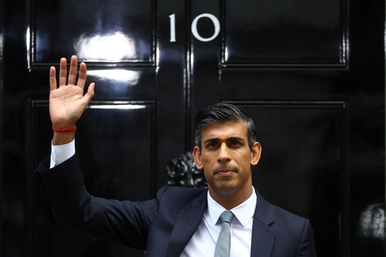 Britain's new Prime Minister Rishi Sunak waves in front of Number 10 Downing Street, in London, Britain, October 25, 2022. REUTERS/Hannah McKay