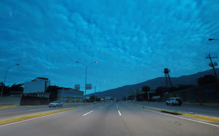 The Caracas-La Guaira highway is seen through a tinted car window in Caracas, Venezuela, March 23, 2019. REUTERS/Ivan Alvarado