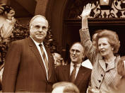 <p>Former British Prime Minister Margaret Thatcher waves to well wishers as German Chancellor Helmut Kohl (L) looks on during Thatcher’s visit to Germany, Sept. 23, 1998. (Reuters) </p>