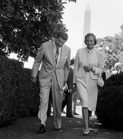 <p>AP</p> President Ronald Reagan walks with Supreme Court nominee Sandra Day O'Connor in the White House Rose Garden, July 1981