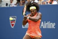 Sep 2, 2015; New York, NY, USA; Serena Williams of the United States hits a backhand against Kiki Bertens of the Netherlands (not pictured) on day three of the 2015 U.S. Open tennis tournament at USTA Billie Jean King National Tennis Center. Williams won 7-6 (5), 6-3. Mandatory Credit: Geoff Burke-USA TODAY Sports