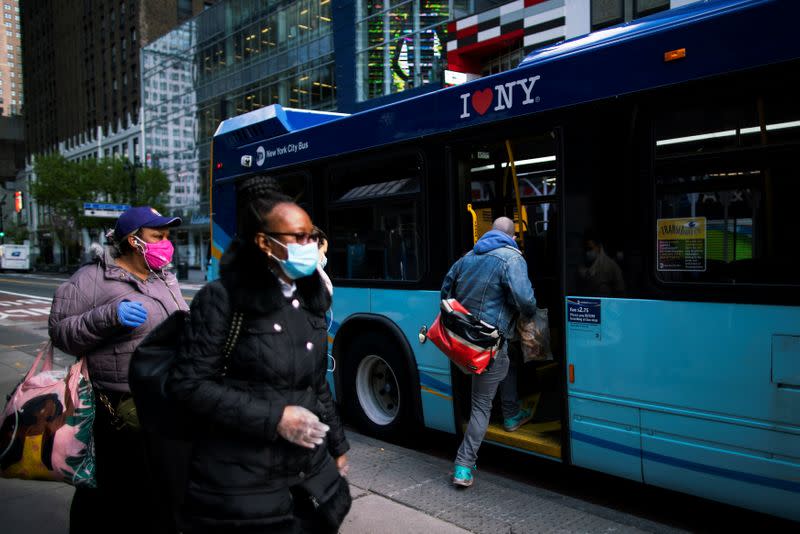 People go into the New York City The Metropolitan Transportation Authority (MTA) bus system by the back door, during the outbreak of the coronavirus disease (COVID-19) in New York City, New York