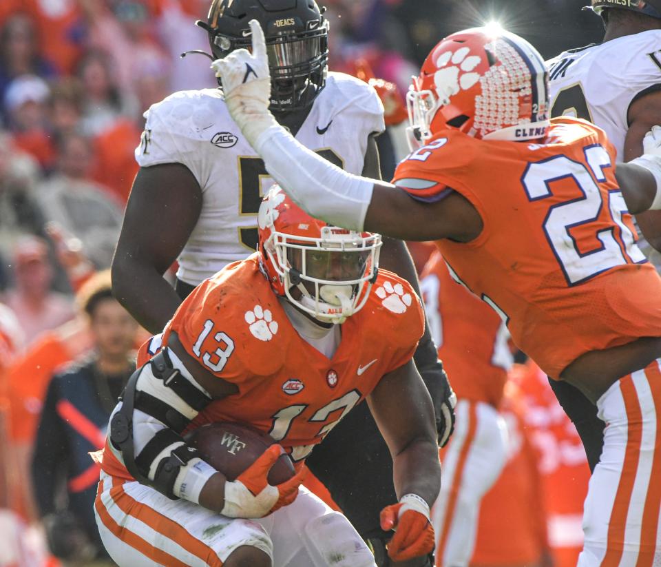 Clemson defensive tackle Tyler Davis (13) picked up a fumble during the third quarter at Memorial Stadium in Clemson, South Carolina Saturday, November 20, 2021.