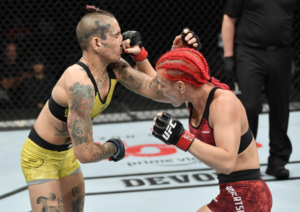 EDMONTON, ALBERTA - JULY 27:   (R-L) Gillian Robertson of Canada punches Sarah Frota of Brazil in their flyweight bout during the UFC 240 event at Rogers Place on July 27, 2019 in Edmonton, Alberta, Canada. (Photo by Jeff Bottari/Zuffa LLC/Zuffa LLC)