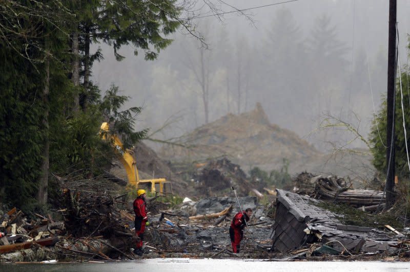 Search and rescue personnel work in the debris field on March 27, 2014, in Oso, Wash., five days after a mudslide killed 43 people. File Photo by Ted Warren/Pool