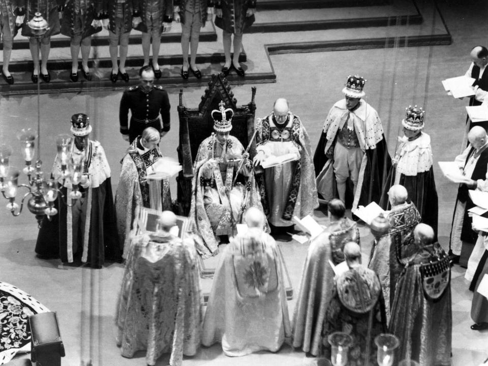 King George VI sits on a throne during his coronation at Westminster Abbey on May 12, 1937.