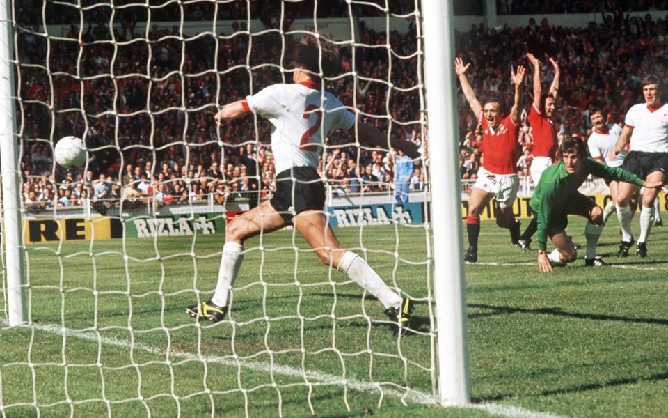 Lou Macari's shot is deflected off team-mate Jimmy Greenhoff for the winning goal in the 1977 FA Cup final - ‘The most important thing is City don’t do the Treble’ – Man Utd’s class of ’77 on FA Cup final - Colorsport/Shutterstock
