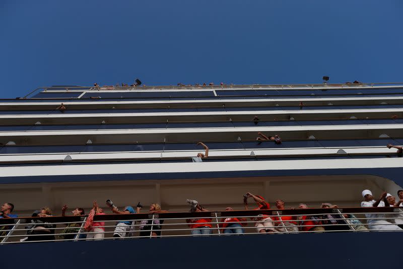 Passengers onboard MS Westerdam, a cruise ship that spent two weeks at sea after being turned away by five countries over fears that someone aboard might have the coronavirus, are seen in Sihanoukville