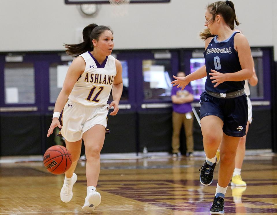 Ashland University's Sophia Fortner (12) brings the ball down court against Cedarville University's Emily Chapman (0) during college women's basketball action Monday, Jan. 24, 2022 at Kates Gym. TOM E. PUSKAR/TIMES-GAZETTE.COM