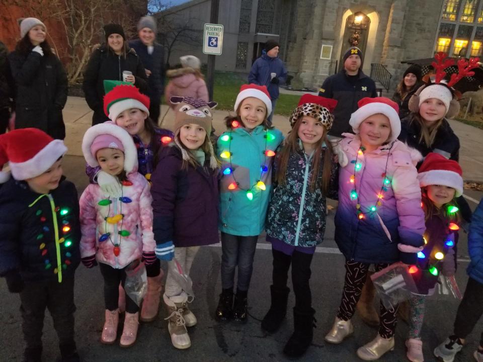 Cousins smile at the start of the Hornell holiday parade on Saturday.