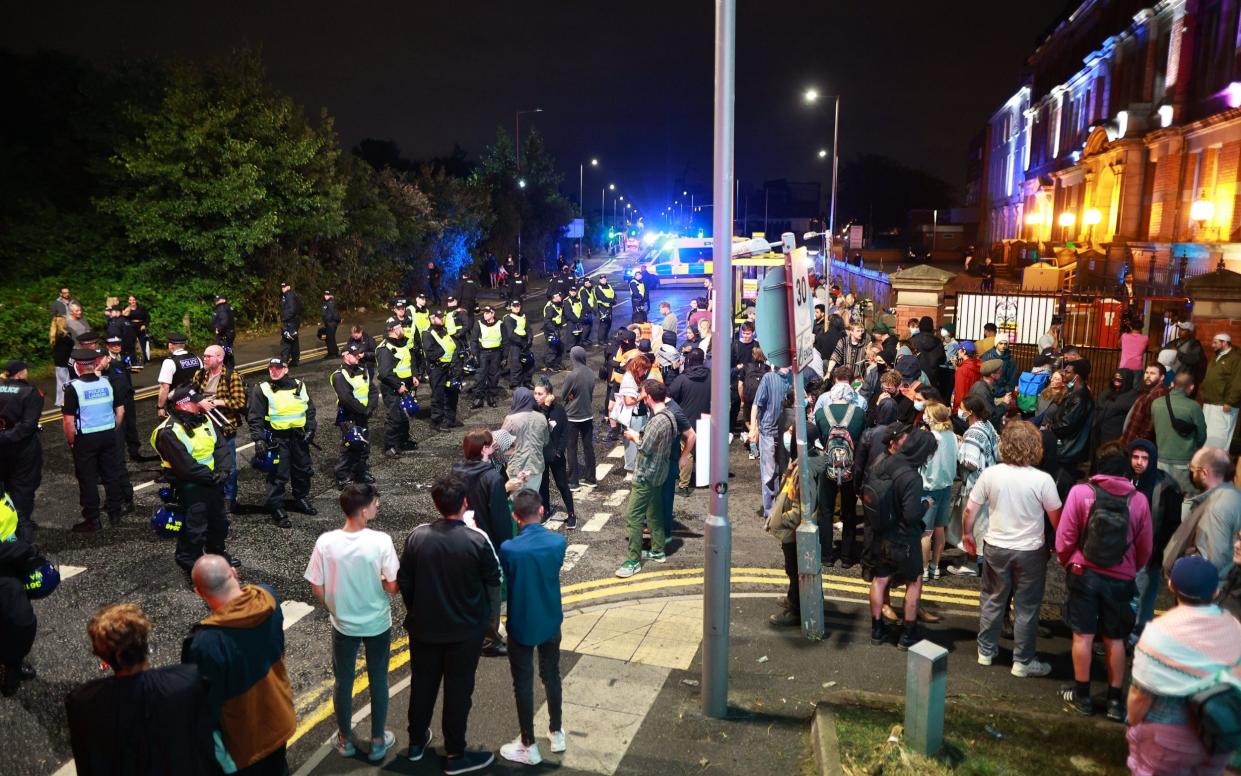 Police ringfence demonstrators and counter-protesters in Liverpool