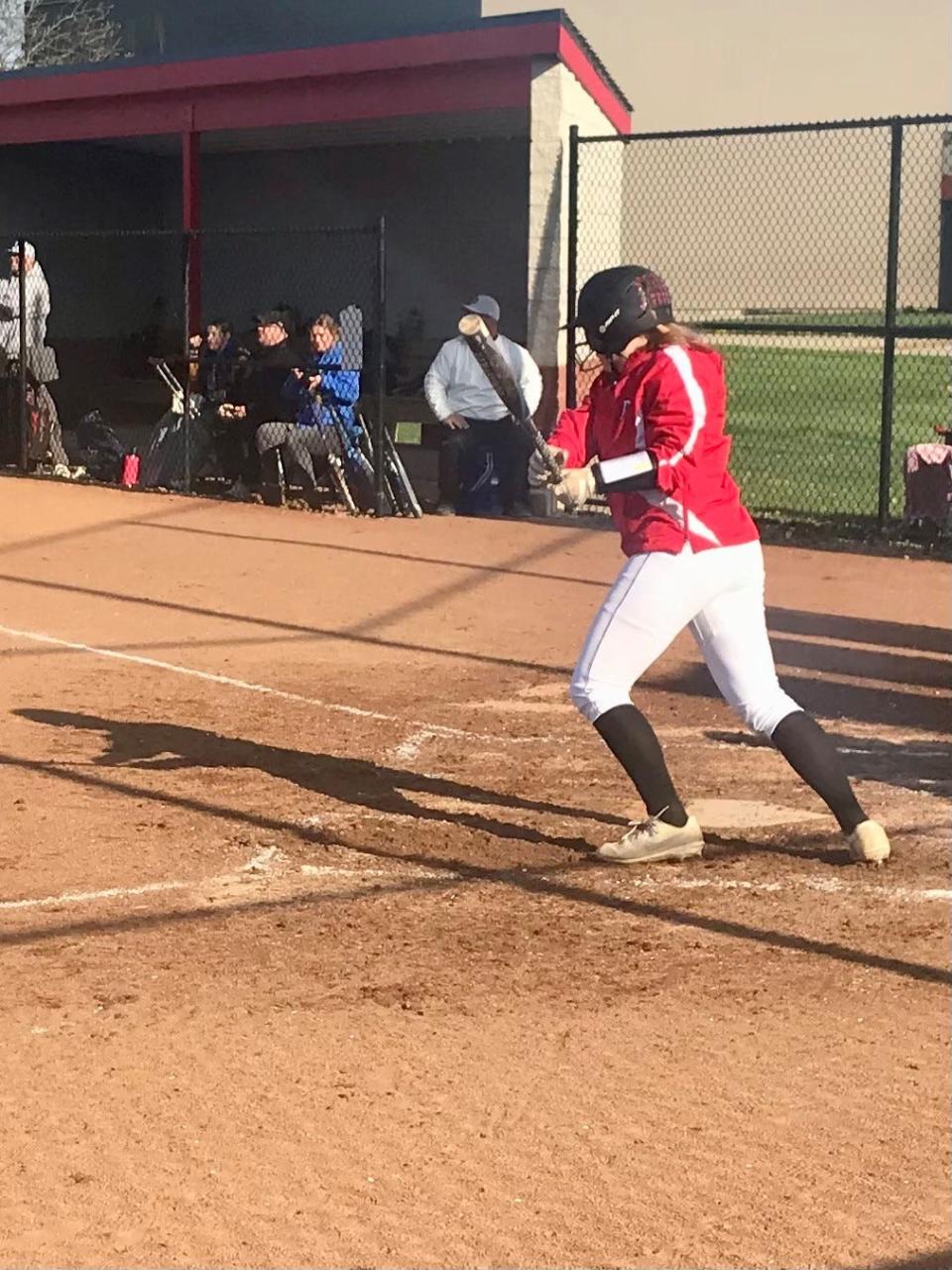 Pleasant's Gracelyn Staley hits a double during a home softball game with Ontario last year.