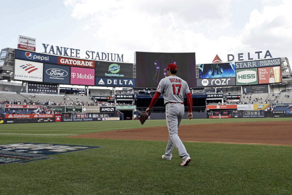 Los Angeles Angels pitcher Shohei Ohtani walks onto the field to warm up for his start against the New York Yankees in a baseball game on Wednesday, June 30, 2021, in New York. (AP Photo/Adam Hunger)