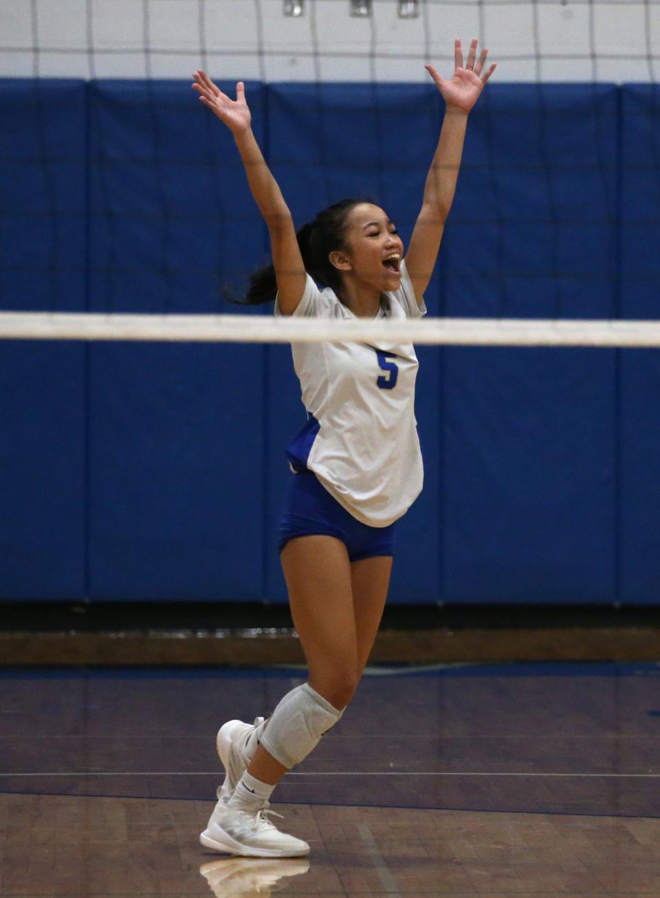 Schroeder's Maddie Siphakongviseth celebrates a Webster point in the fifth and final set against Penfield.