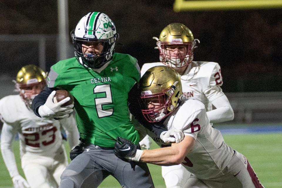 Watterson's Dominic Purcell tries to wrap up Celina's Zander Jones during a Division III state semifinal.