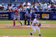 Los Angeles Dodgers relief pitcher Alex Vesia, right, celebrates after striking out St. Louis Cardinals' Lars Nootbaar, left, as catcher Will Smith, second from right, and home plate umpire Jim Wolf watch during the seventh inning of a baseball game Sunday, April 30, 2023, in Los Angeles. (AP Photo/Mark J. Terrill)