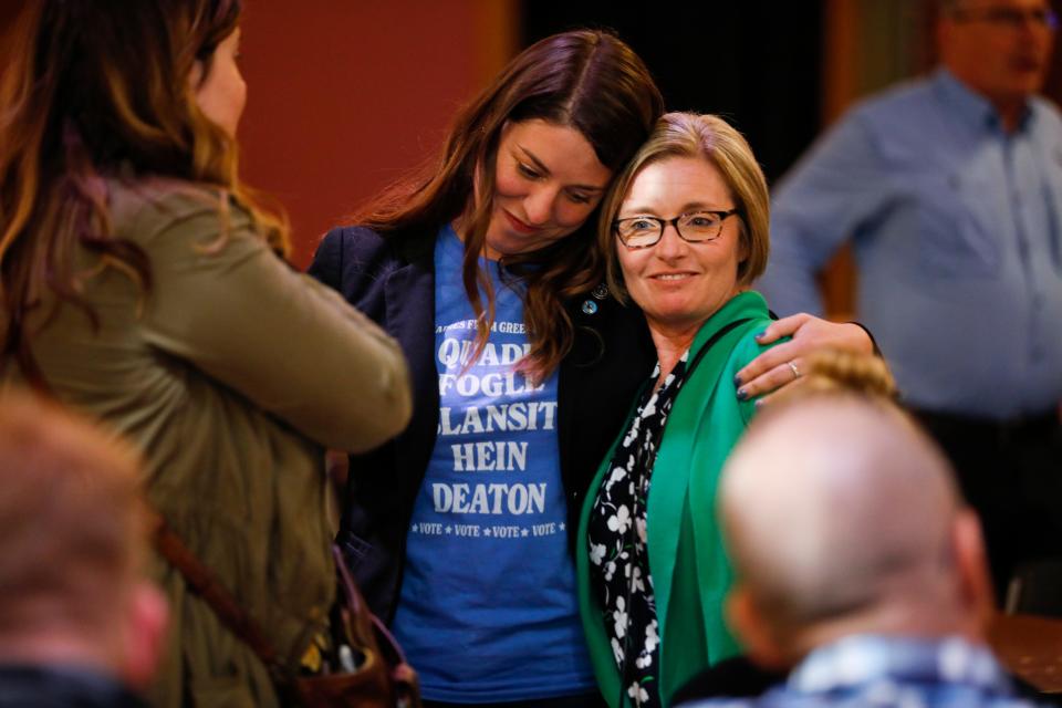 Rep. Stephanie Hein and Rep. Crystal Quade embrace at a Democrat watch party at the Old Glass Place in Downtown Springfield on Tuesday, Nov. 8, 2022.