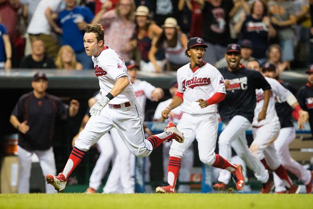 Tyler Naquin of the Indians races home on his game-winning inside-the-park home run. (Getty Images)