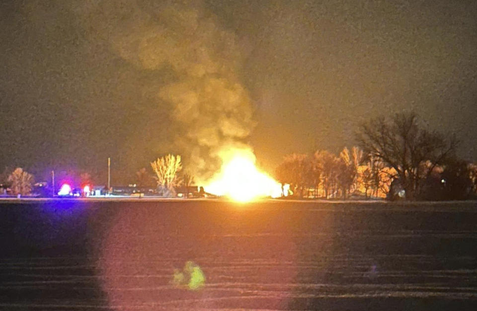A resident in the area shared a photo of the fiery derailment, saying they were awoken and evacuated by the Raymond Fire Department early Thursday. (Jamie Bestge / Facebook)