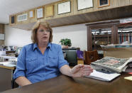 In this Aug. 5, 2019, photo, Susan Reeves sits in her office at the Mount Vernon Optic-Herald as she responds to questions during an interview in Mount Vernon, Texas. Reeves is the publisher of the community newspaper that has been published since 1874 and owned by her family since 1952. Reeves said she was immediately supportive of the school board's decision to hire Art Briles as the high school football coach and believes that is the case for most of the community. (AP Photo/Tony Gutierrez)