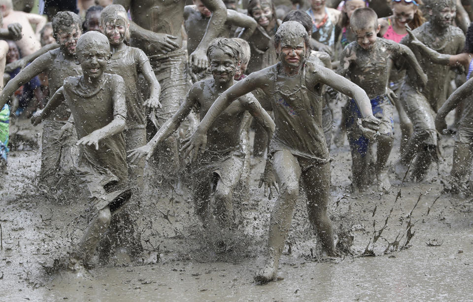 <p>Kids participate in races during Mud Day at the Nankin Mills Park, July 11, 2017 in Westland, Mich. (Photo: Carlos Osorio/AP) </p>