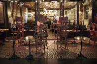 A bar terrace is closed to meet the curfew in Paris, Saturday Oct. 17, 2020. French restaurants, cinemas and theaters are trying to figure out how to survive a new curfew aimed at stemming the flow of record new coronavirus infections. The monthlong curfew came into effect Friday at midnight, and France is deploying 12,000 extra police to enforce it. (AP Photo/Lewis Joly)