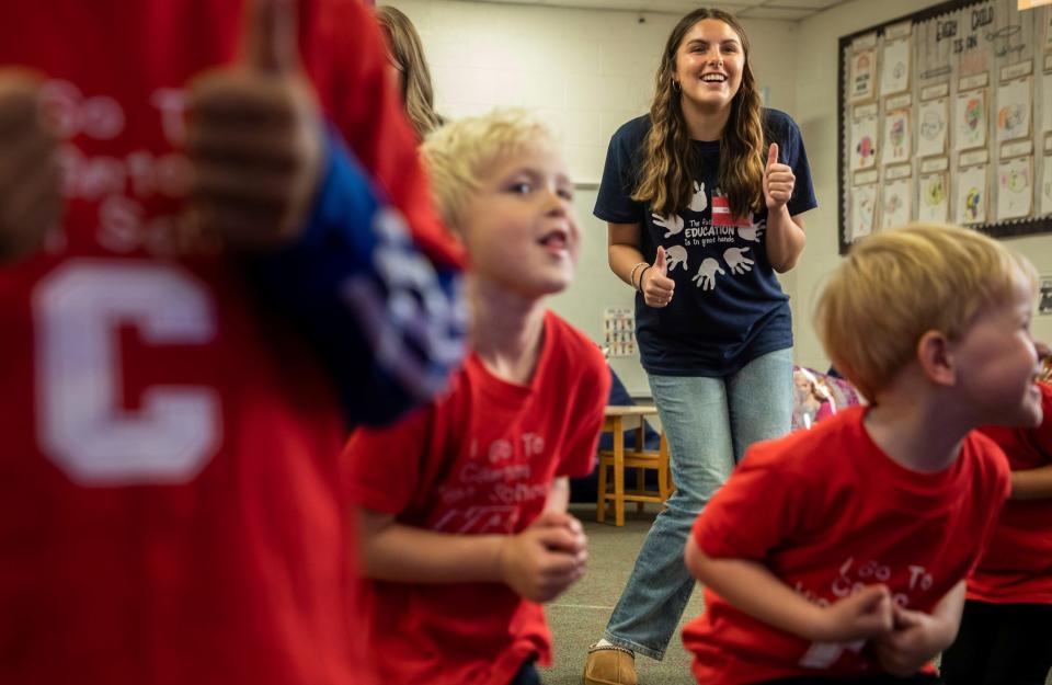 Ella Schimmelpfenneg, a student at Canton High School, smiles as she dances with preschool students during a Kiddie Campus class in Canton on Oct. 26, 2023. The Kiddie Campus class is one of the specialized classes offered at the Plymouth-Canton Educational Park that is geared toward students who might find a career related to early childhood education or teaching.