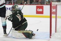 Minnesota Wild goaltender Marc-Andre Fleury gives up a goal to Seattle Kraken center Matty Beniers during the second period of an NHL hockey game Thursday, April 18, 2024, in St. Paul, Minn. (AP Photo/Abbie Parr)