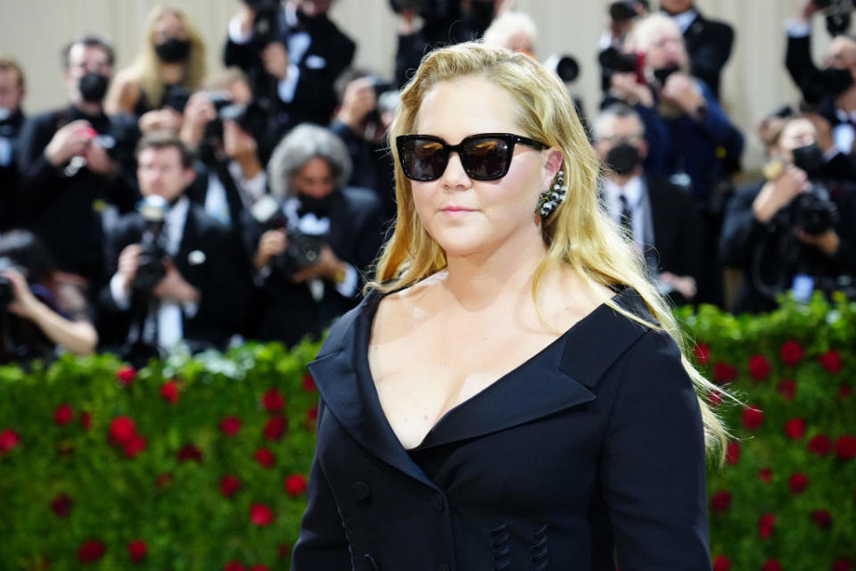 Amy at the MET Gala wearing large sunglasses