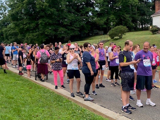 Runners and walkers prepare for the 2022 Flamingo Race by Hospice of Guernsey.