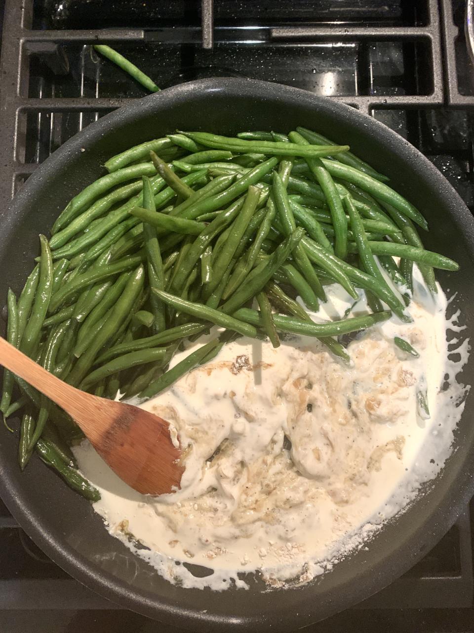 The author whipping up Home Chef's Thanksgiving side recipe for caramelized onion green bean casserole. As an added bonus, most recipes could be made with one or two pots and pans. (Photo: Danielle Gonzalez / HuffPost Finds)