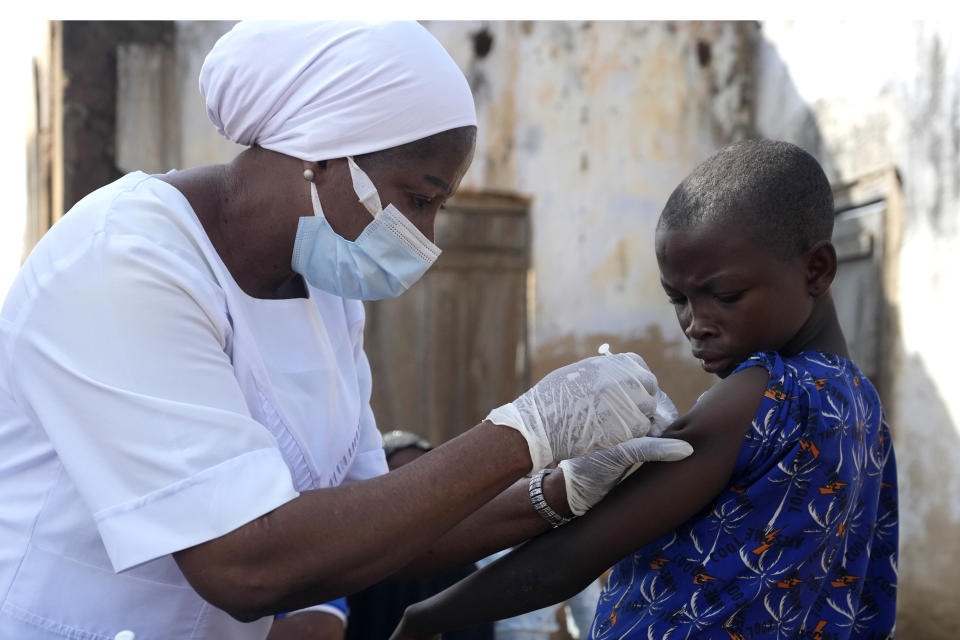 A health worker administers a cervical cancer vaccine HPV Gardasil to a girl on the street in Ibadan, Nigeria, on May 27, 2024. African countries have some of the world's highest rates of cervical cancer. Growing efforts to vaccinate more young girls for the human papillomavirus are challenged by the kind of vaccine hesitancy seen for some other diseases. Misinformation can include mistaken rumors that girls won't be able to have children in the future. Some religious communities must be told that the vaccine is "not ungodly." More than half of Africa's 54 nations – 28 – have introduced the vaccine in their immunization programs, but only five have reached the 90% coverage that the continent hopes to achieve by 2030. (AP Photo/Sunday Alamba)