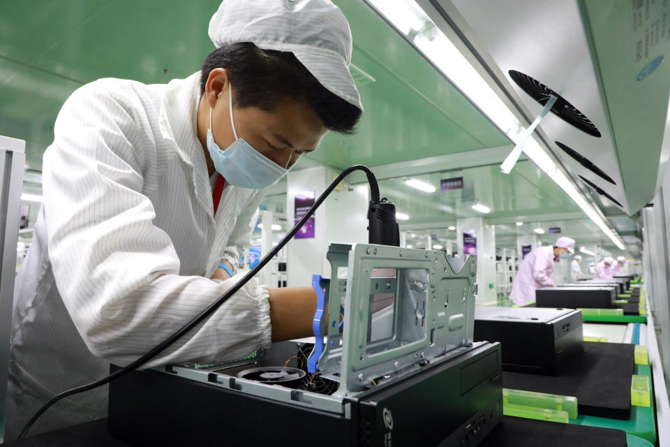 XIAMEN, CHINA - MAY 15: Employees work on the production line at Kuntai production base of Digital China Group on May 15, 2020 in Xiamen, Fujian Province of China. (Photo by VCG/VCG via Getty Images)