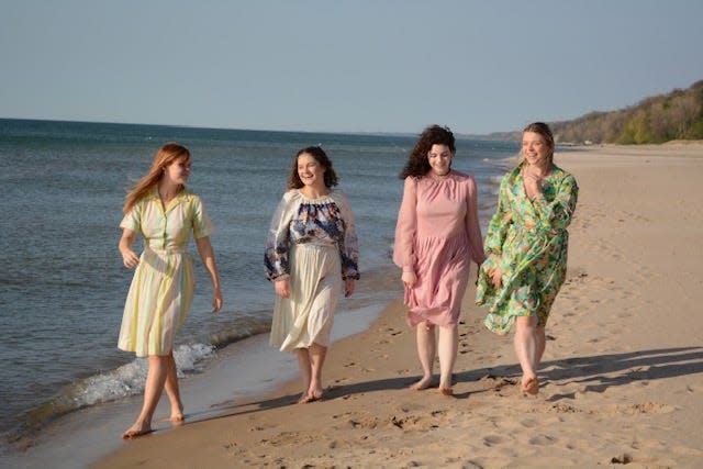 The actors who play the March sisters in GhostLight Theatre's production of "Little Women" -- Sofia Pate, left, as Beth, Kelly Collins as Jo, Skyler Scott as Meg, Cecilia Petrush as Amy -- walk along the beach at Lake Michigan in this publicity photo. The production opens May 19 and continues through May 29, 2022, at the theater in Benton Harbor.