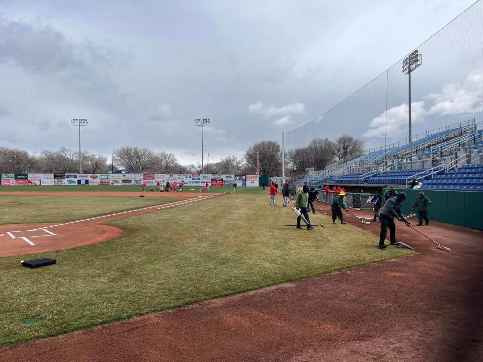 Grounds crews at Ricketts Park help remove water from the field after persistent rain delayed the start of the Scorpion Invitational baseball tournament on Thursday, March 16, 2023.