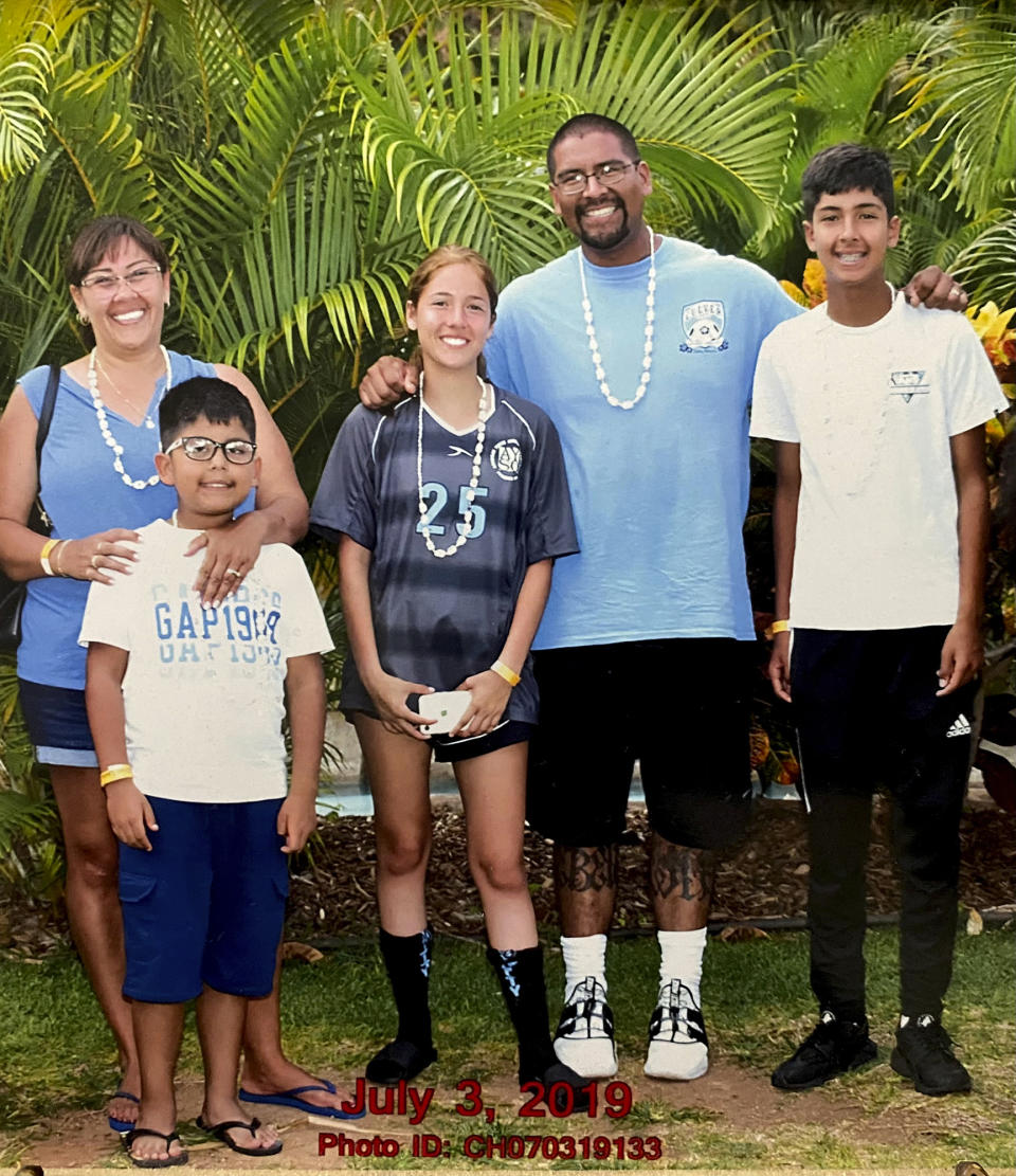 This photo provided by Adriana Medina shows Guillermo Medina and his wife, Adriana, with their children on July 3, 2019. Adriana Medina, whose husband was suffering from a mental health crisis when she called a nonemergency number for help last year sued Culver City police Tuesday, Jan. 31, 2023, alleging they shot her unarmed husband in the back as he was running from officers. (Medina Family Photo via AP)