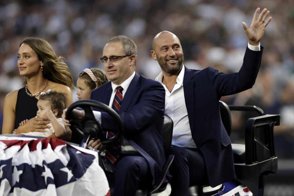 CORRECTS THAT JETER WAS INDUCTED IN 2021, NOT THIS YEAR - Baseball Hall of Famer Derek Jeter waves during a ceremony honoring his induction to the hall in 2021, before a baseball game between the Tampa Bay Rays and the New York Yankees on Friday, Sept. 9, 2022, in New York. (AP Photo/Adam Hunger)