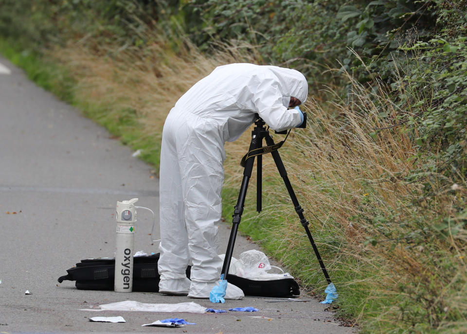 A police investigator at the scene of an incident, near Sulhamstead, Berkshire, where a Thames Valley Police officer was killed whilst attending a reported burglary on Thursday evening.