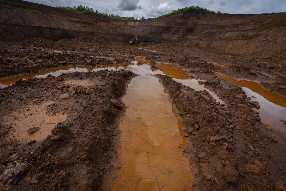 An excavator digs chromium at a mine near Kaliapani village in Jajpur district, Odisha, India Thursday, July 6, 2023. Chromium, used mostly as a coating to stop rust in steel and car parts, has been deemed necessary for India's transition to cleaner energy. (AP Photo/Anupam Nath)