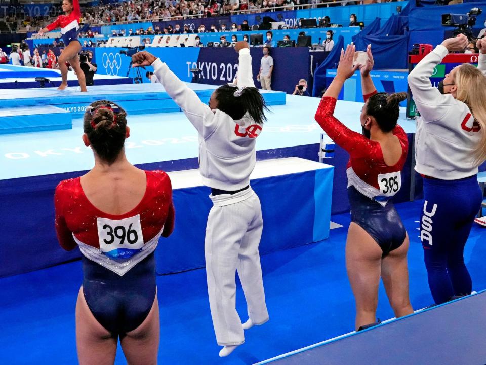 Simone Biles cheers on teammate Jordan Chiles.