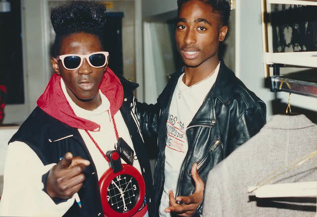 <p>Clarence Gatson/Gado/Getty </p> Flavor Flav with rapper Tupac Shakur at the 1989 American Music Awards in Los Angeles, California