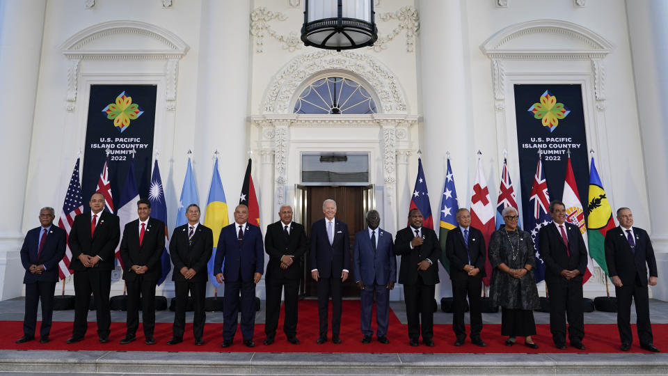 President Joe Biden, center, poses for a photo with Pacific Island leaders on the North Portico of the White House in Washington, Thursday, Sept. 29, 2022. From left, New Caledonia President Louis Mapou, Tonga Prime Minister Siaosi Sovaleni, Palau President Surangel Whipps Jr., Tuvalu Prime Minister Kausea Natano, Micronesia President David Panuelo, Fiji Prime Minister Josaia Voreqe Bainimarama, Biden, Solomon Islands Prime Minister Manasseh Sogavare, Papua New Guinea Prime Minister James Marape, Marshall Islands President David Kabua, Samoa Prime Minister Fiame Naomi Mata'afa, French Polynesia President Edouard Fritch and Cook Islands Prime Minister Mark Brown. (AP Photo/Susan Walsh)