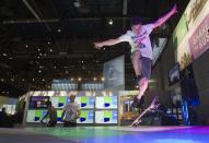 Skateboarder Peter Betti, 18, a member of the Polaroid Action team, performs at the Polaroid booth during the 2014 International Consumer Electronics Show (CES) in Las Vegas, Nevada, January 7, 2014. REUTERS/Steve Marcus (UNITED STATES - Tags: BUSINESS SCIENCE TECHNOLOGY)