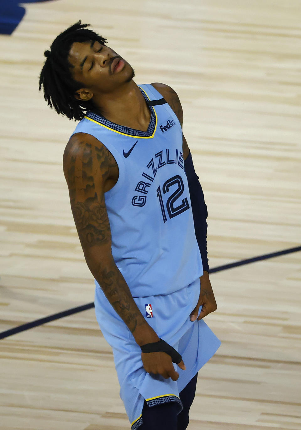 Memphis Grizzlies' Ja Morant reacts after a losing to the Portland Trail Blazers in an NBA basketball game Saturday, Aug. 15, 2020, in Lake Buena Vista, Fla. (Kevin C. Cox/Pool Photo via AP)