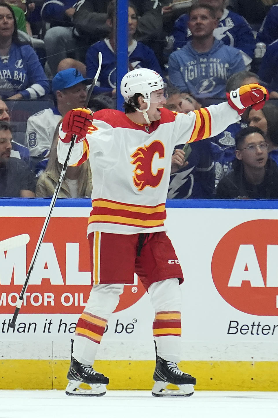 Calgary Flames center Jakob Pelletier (22) celebrates his goal against the Tampa Bay Lightning during the second period of an NHL hockey game Thursday, March 7, 2024, in Tampa, Fla. (AP Photo/Chris O'Meara)