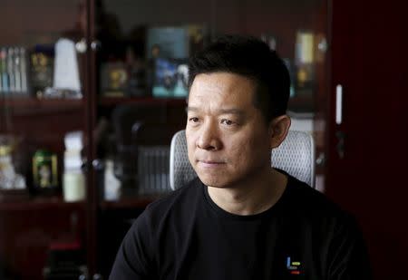Jia Yueting, co-founder and head of Le Holdings Co Ltd, also known as LeEco and formerly as LeTV, looks at a screen as he poses for a photo at his president office after a Reuters interview at LeEco headquarters in Beijing, China, picture taken April 22, 2016. REUTERS/Jason Lee