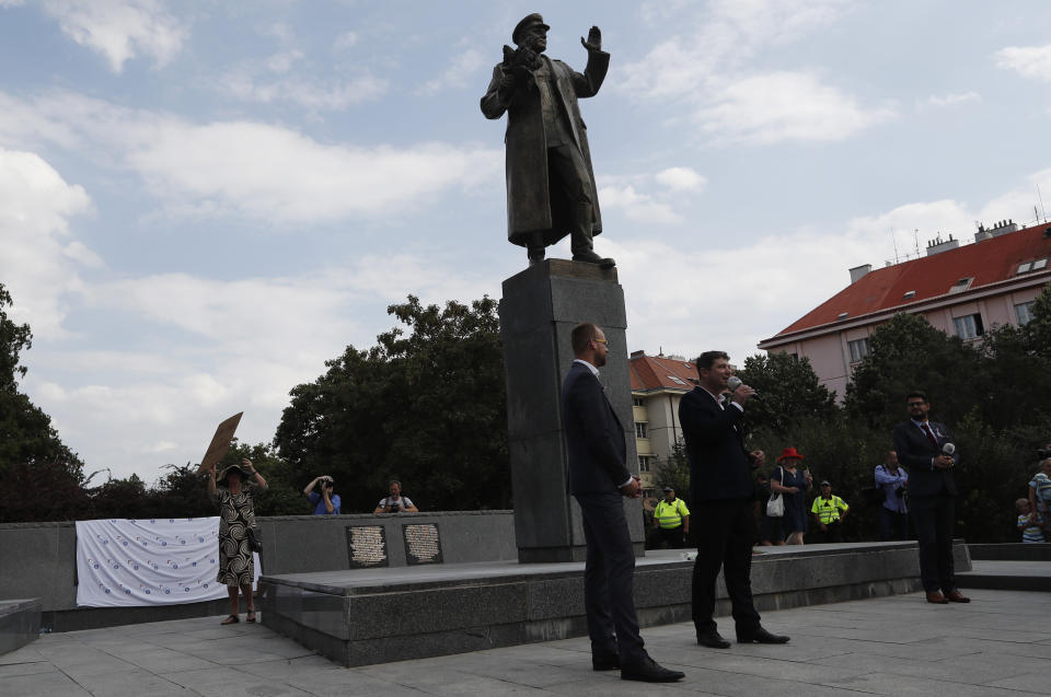 Prague 6 district representatives unveil a new explanatory text about the role of Soviet World War II commander Ivan Stepanovic Konev at his monument in Prague, Czech Republic, Tuesday, Aug. 21, 2018. The new text describes Konev's leading role in crushing the 1956 anti-Soviet uprising in Hungary, his contribution to the construction of the Berlin Wall and the preparation of the 1968 invasion of Czechoslovakia. On Tuesday, Czech Republic is marking the 50th anniversary of the 1968 Soviet-led invasion of Czechoslovakia. (AP Photo/Petr David Josek)